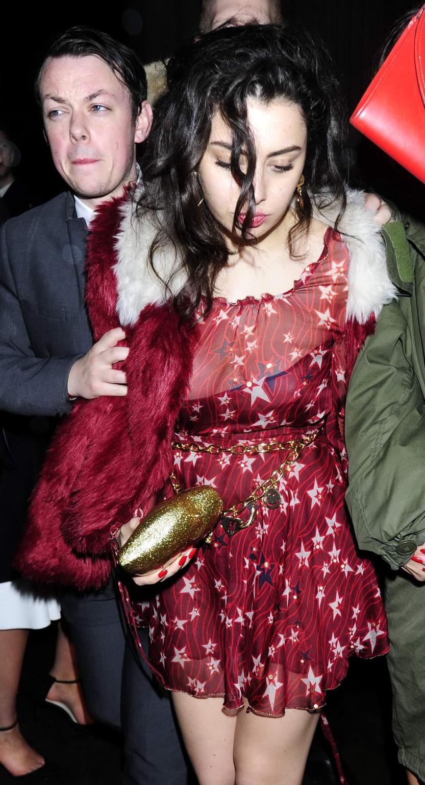 16P Charli XCX busty and braless leaving The Warner Music BRIT Party in London