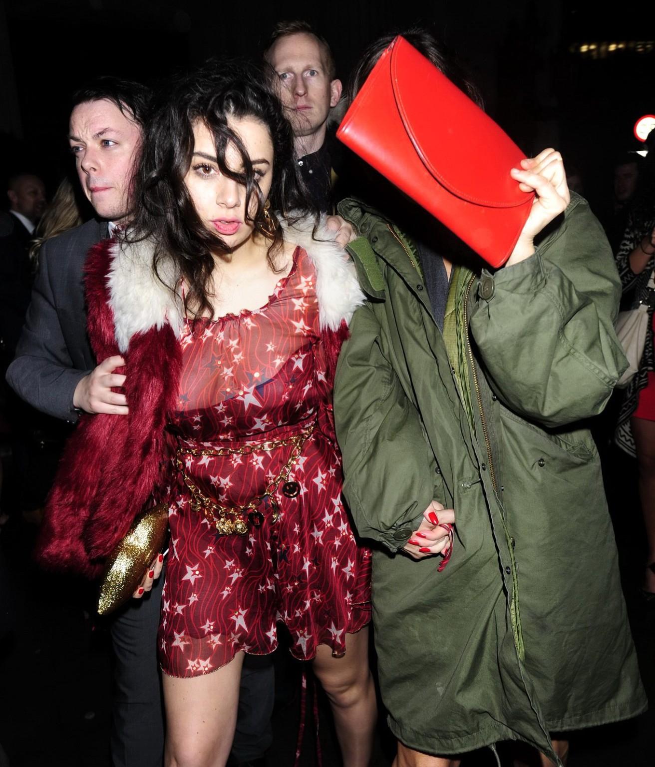 16P Charli XCX busty and braless leaving The Warner Music BRIT Party in London