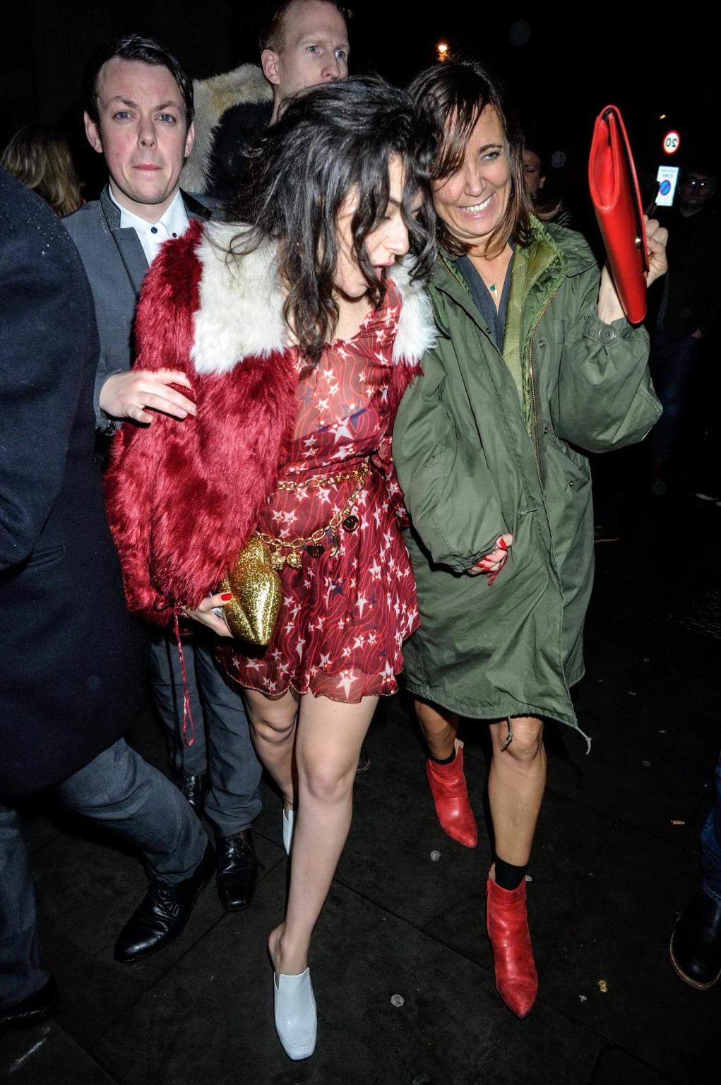 16P Charli XCX busty and braless leaving The Warner Music BRIT Party in London