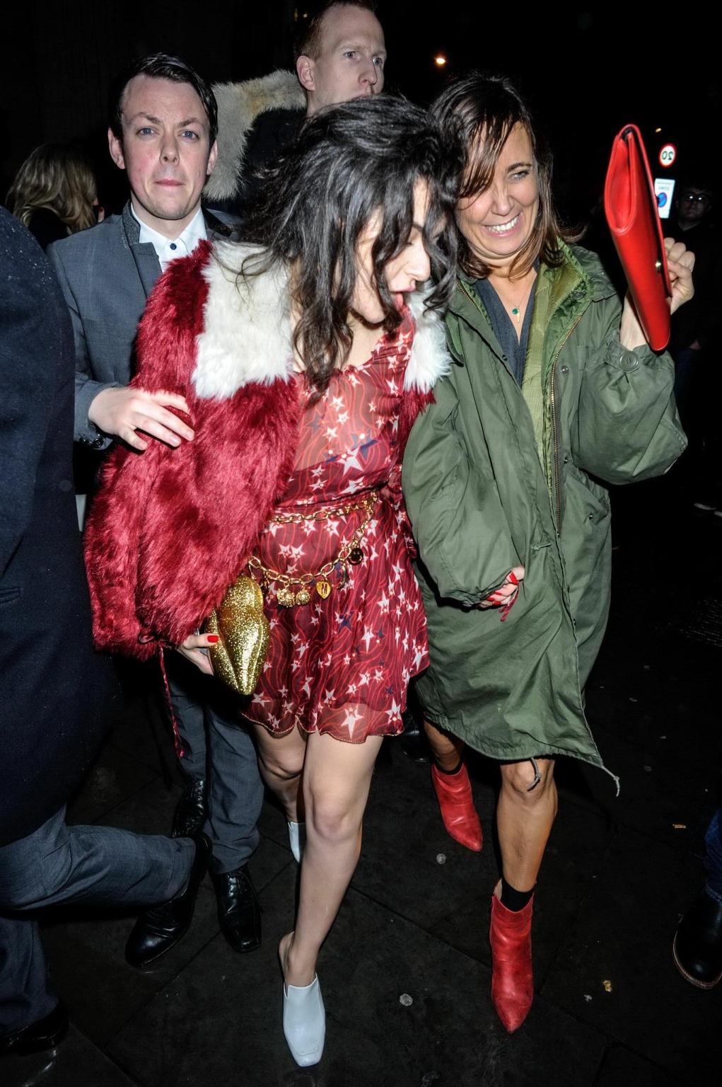 16P Charli XCX busty and braless leaving The Warner Music BRIT Party in London