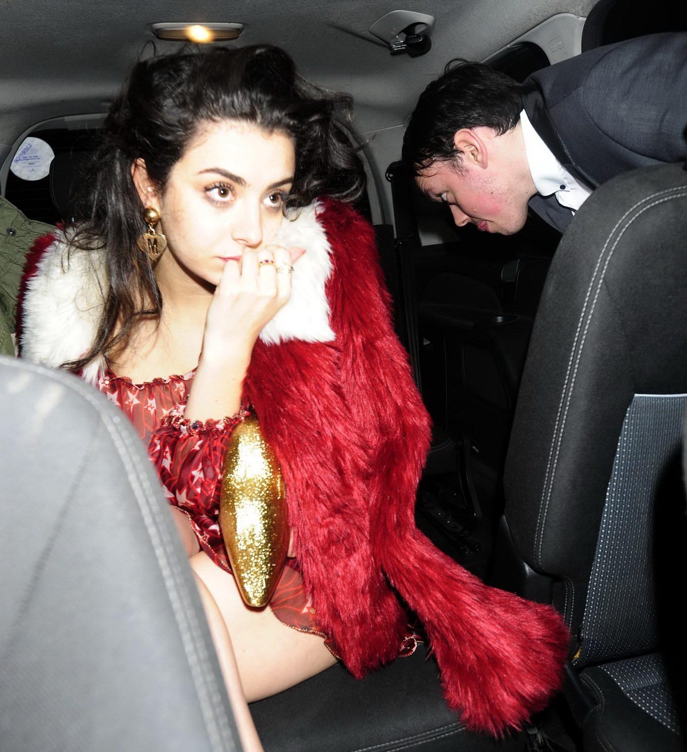 16P Charli XCX busty and braless leaving The Warner Music BRIT Party in London