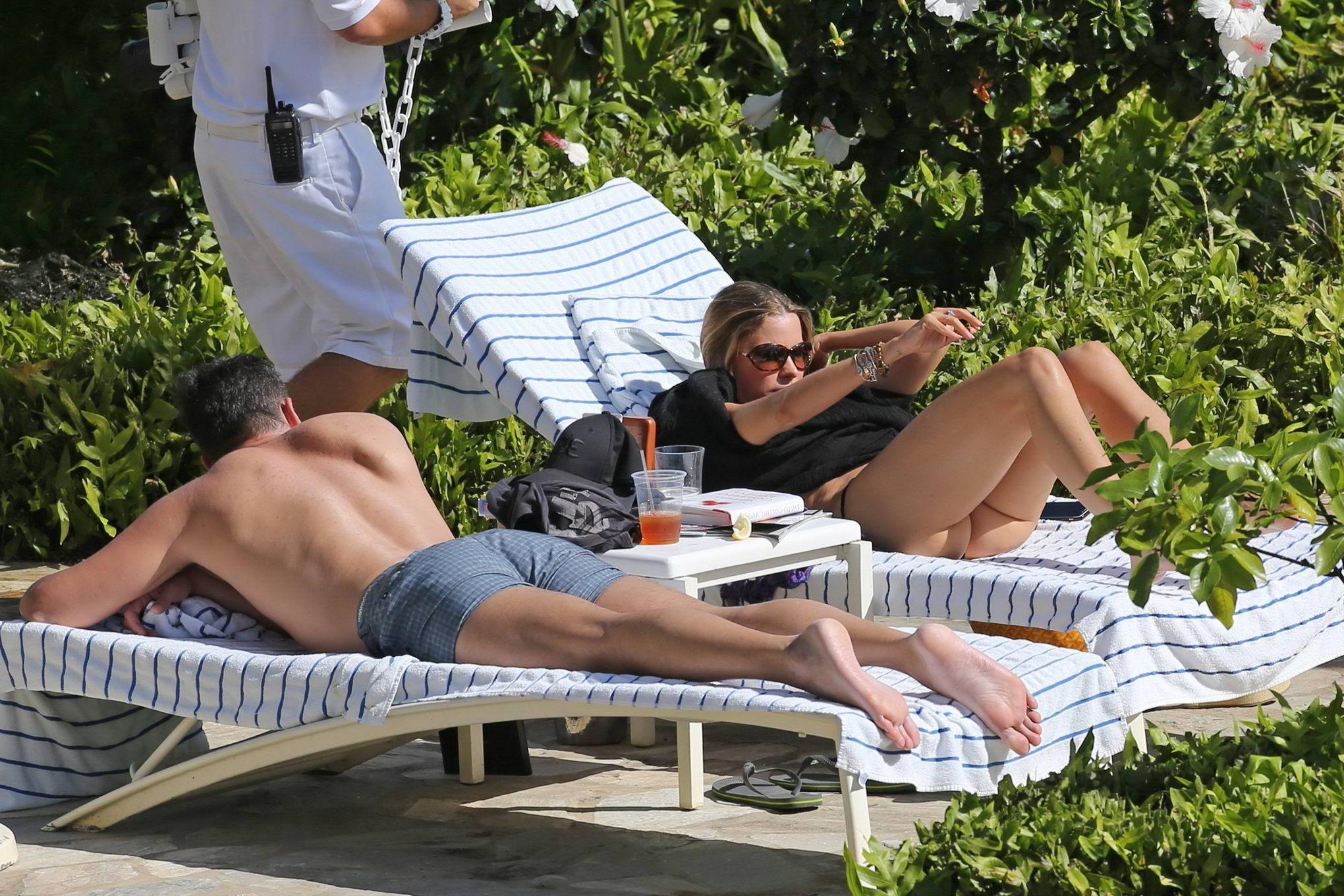 16P Sofia Vergara showing her juicy ass in black bikini poolside in Hawaii
