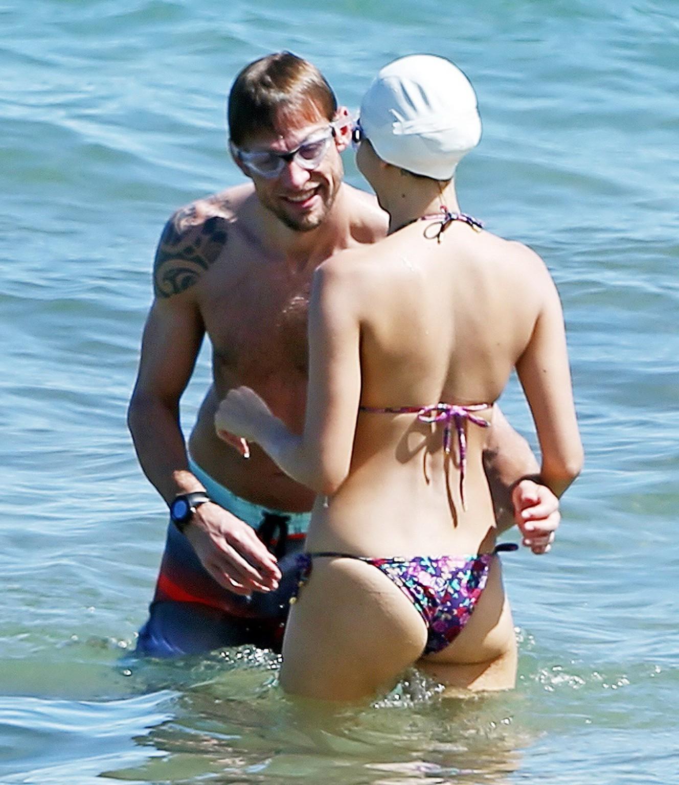 15P Jessica Michibata shows off her juicy ass in a tiny floral bikini at the beach i