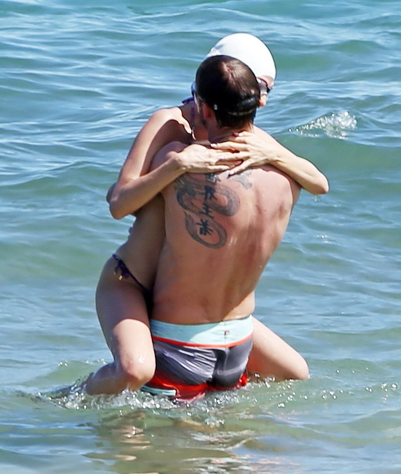 15P Jessica Michibata shows off her juicy ass in a tiny floral bikini at the beach i