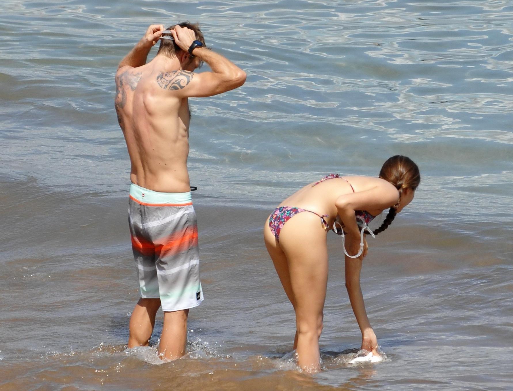 15P Jessica Michibata shows off her juicy ass in a tiny floral bikini at the beach i