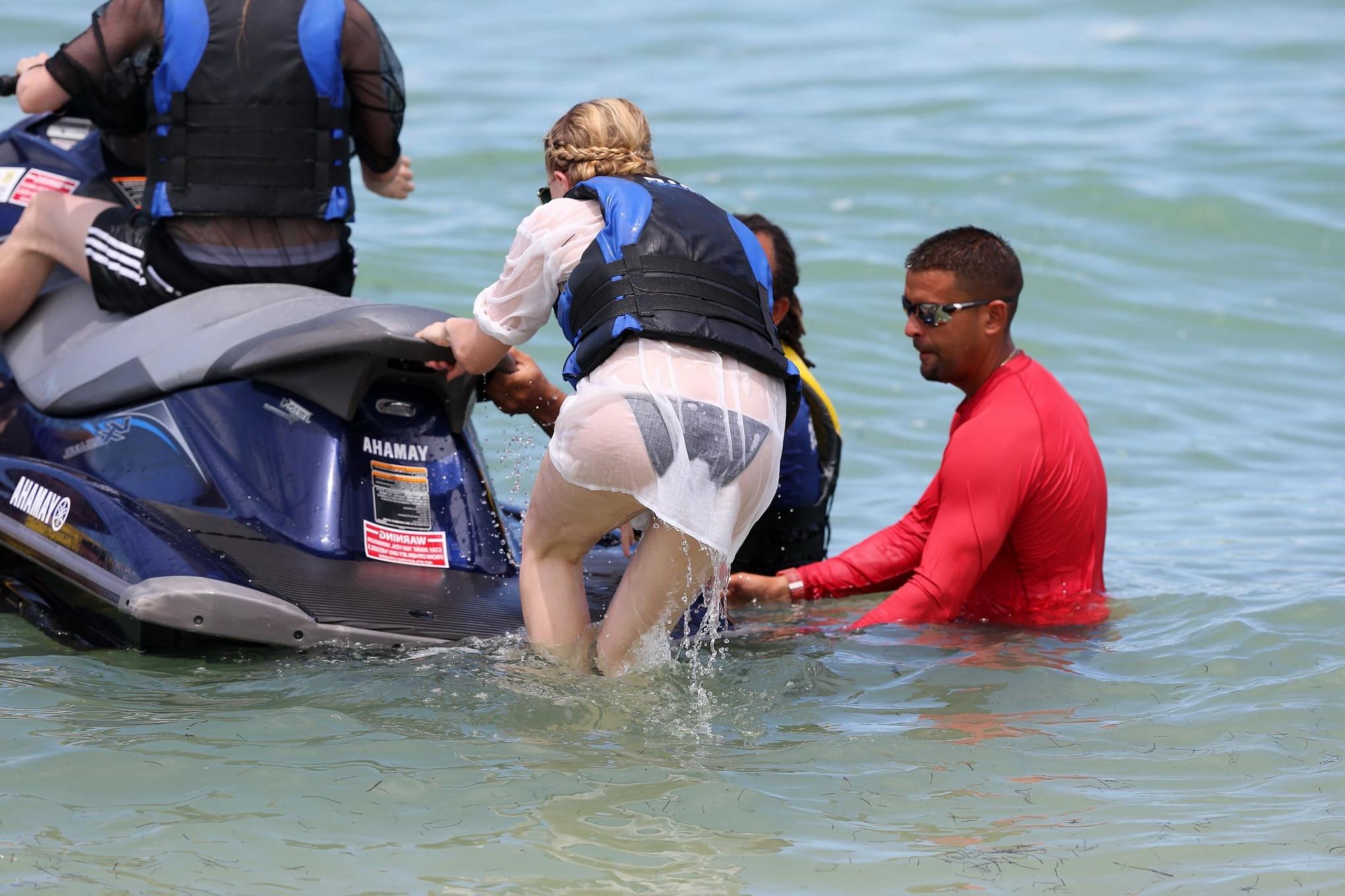 16P Chloe Moretz shows off her juicy ass in a skimpy black bikini at the beach in Mi