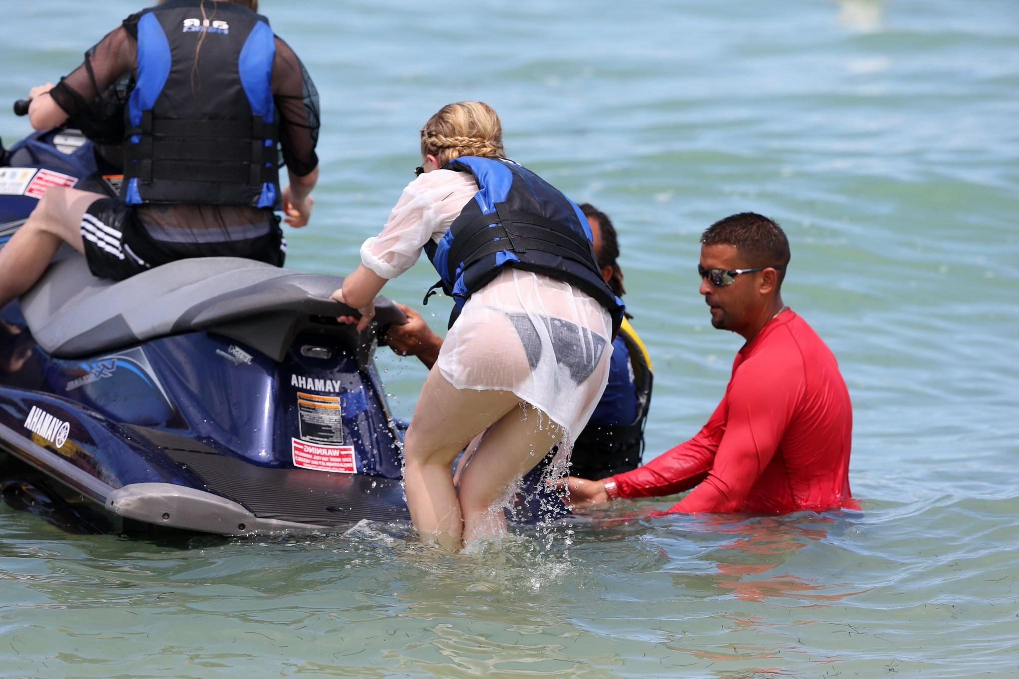 16P Chloe Moretz shows off her juicy ass in a skimpy black bikini at the beach in Mi