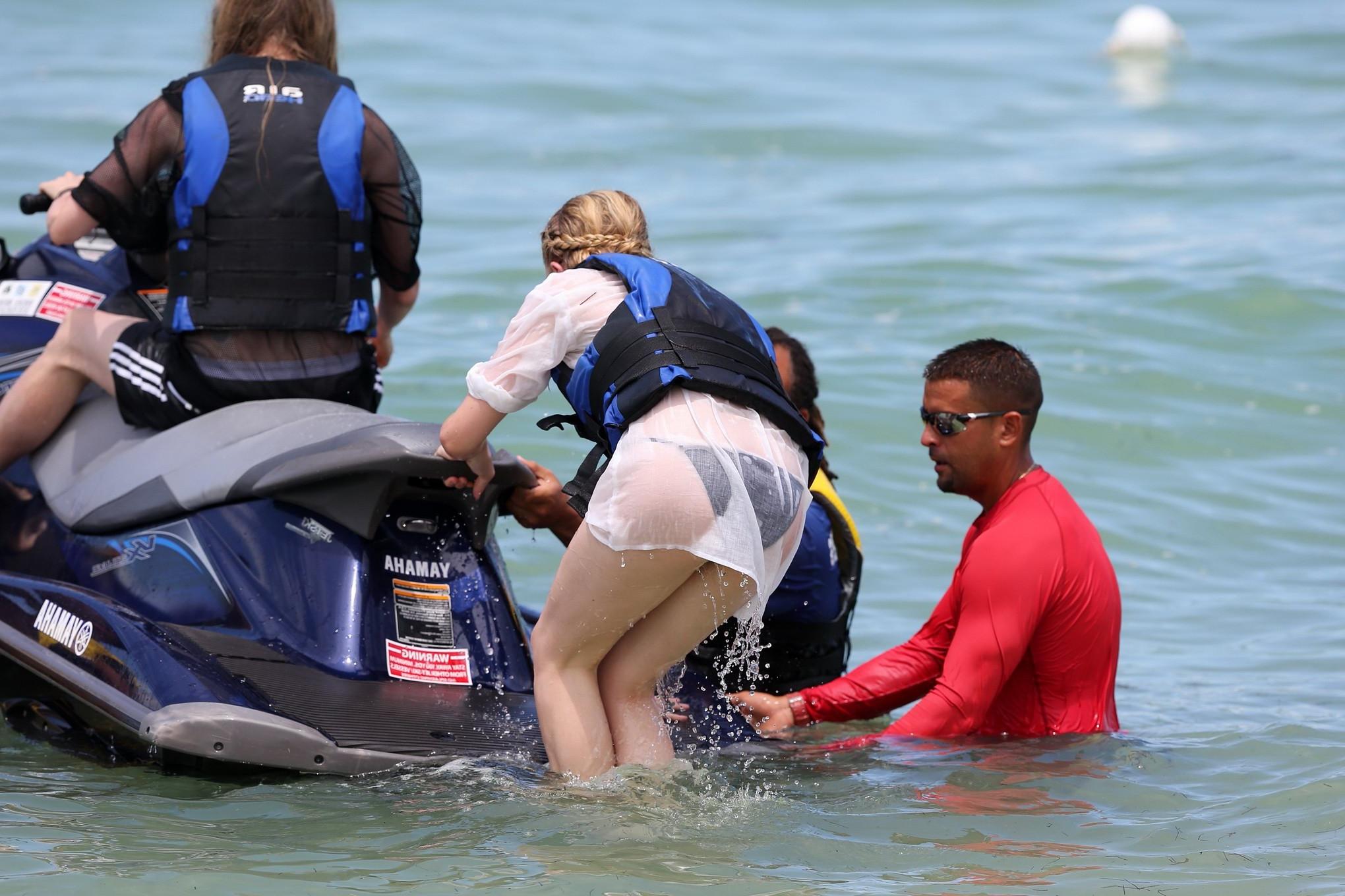 16P Chloe Moretz shows off her juicy ass in a skimpy black bikini at the beach in Mi