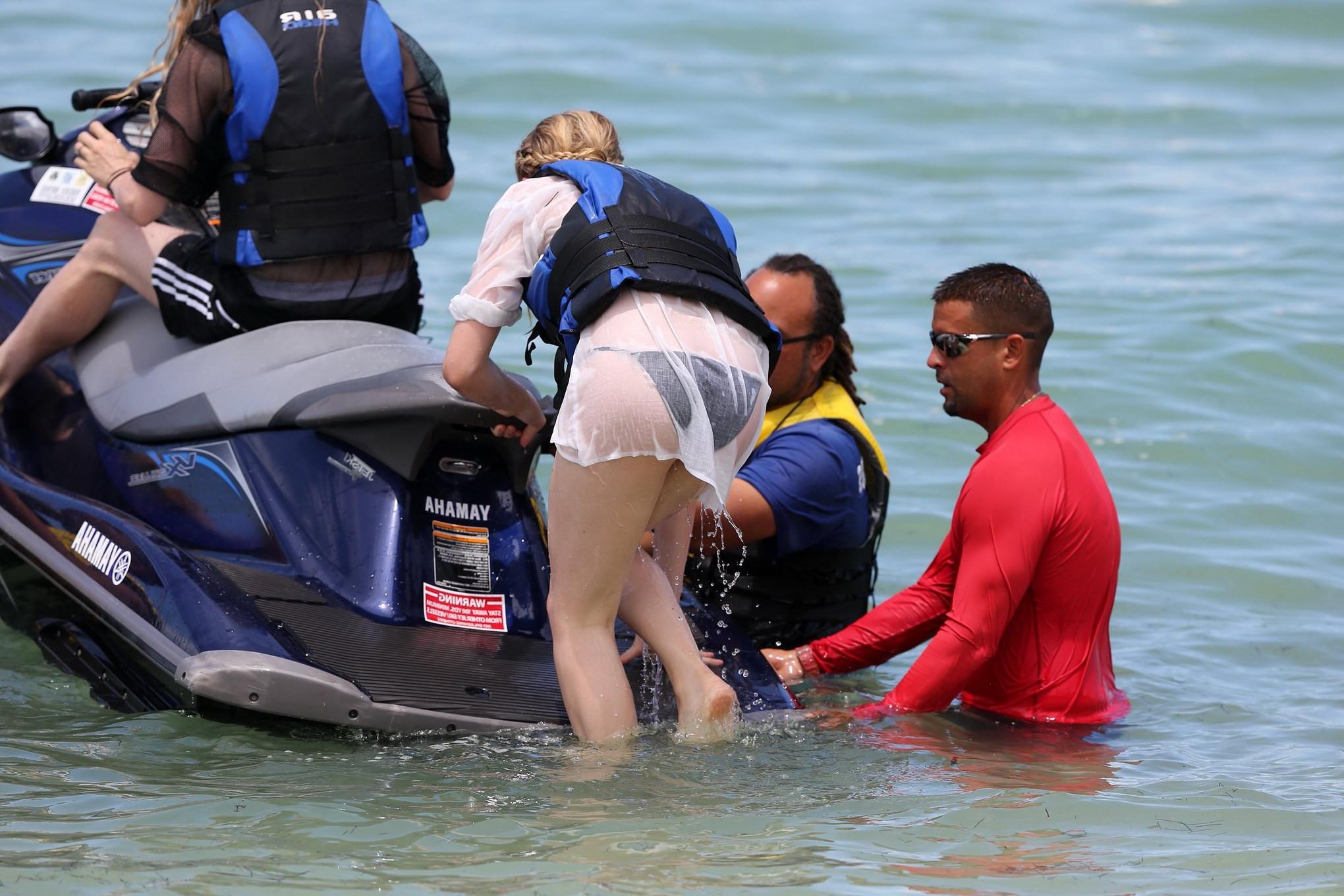 16P Chloe Moretz shows off her juicy ass in a skimpy black bikini at the beach in Mi