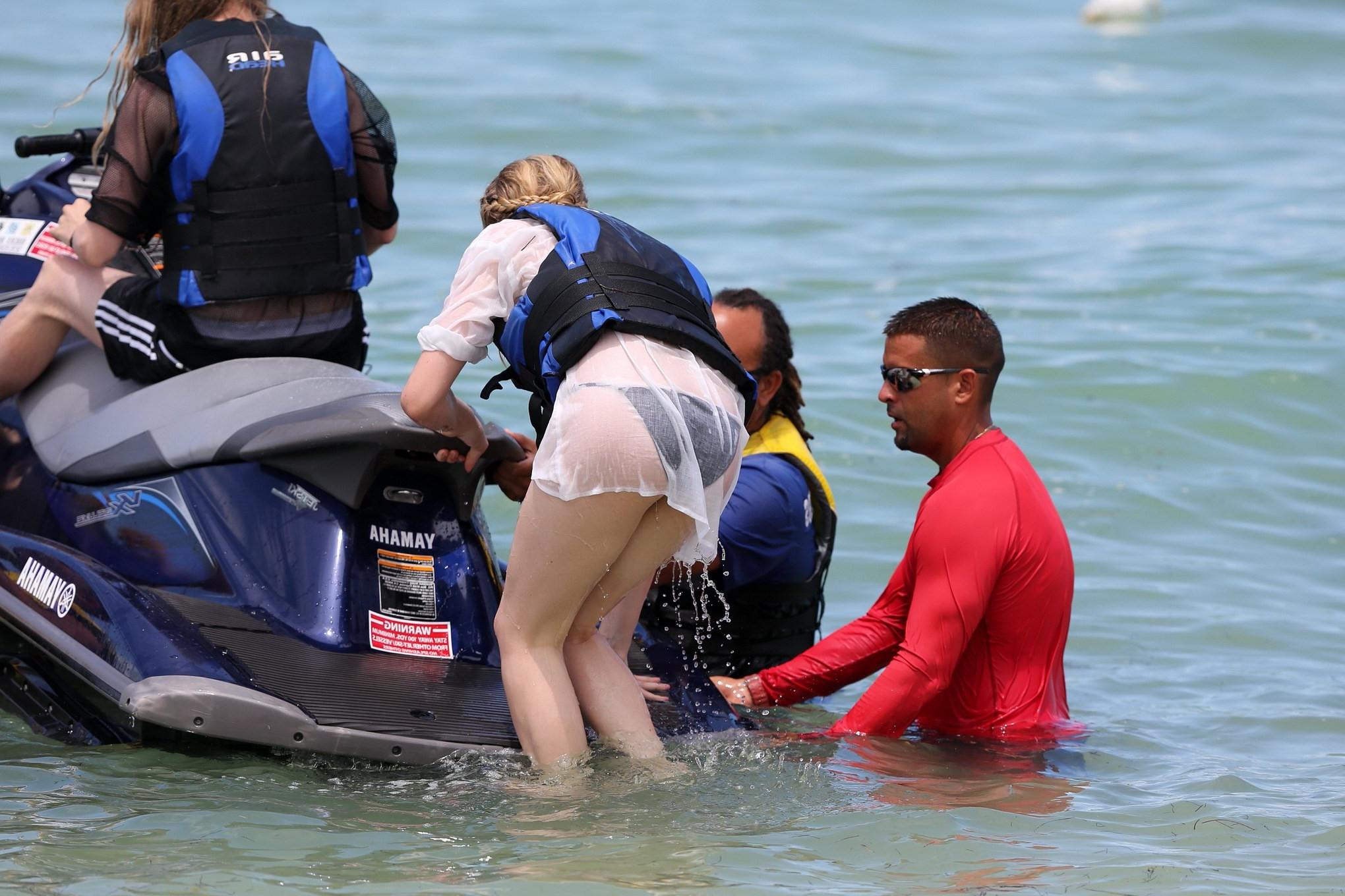 16P Chloe Moretz shows off her juicy ass in a skimpy black bikini at the beach in Mi