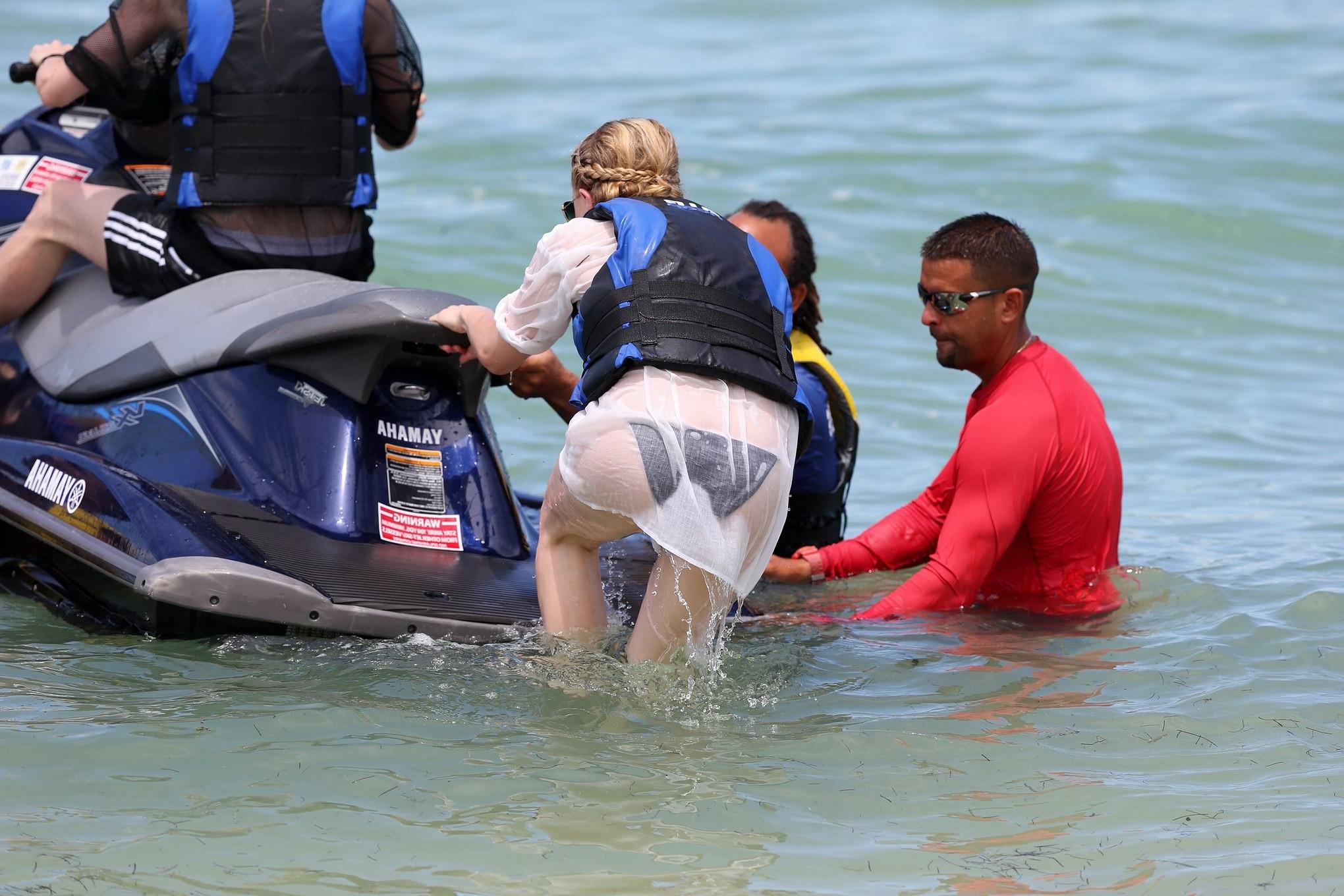 16P Chloe Moretz shows off her juicy ass in a skimpy black bikini at the beach in Mi