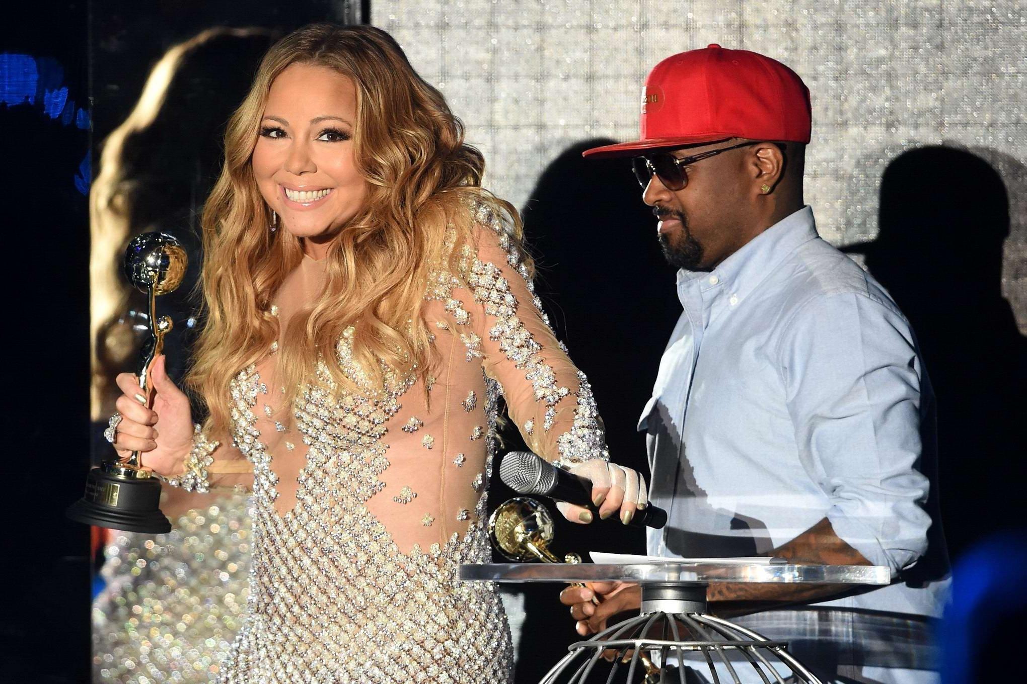16P Mariah Carey cleavy wearing two skimpy dresses at the World Music Awards in Mont