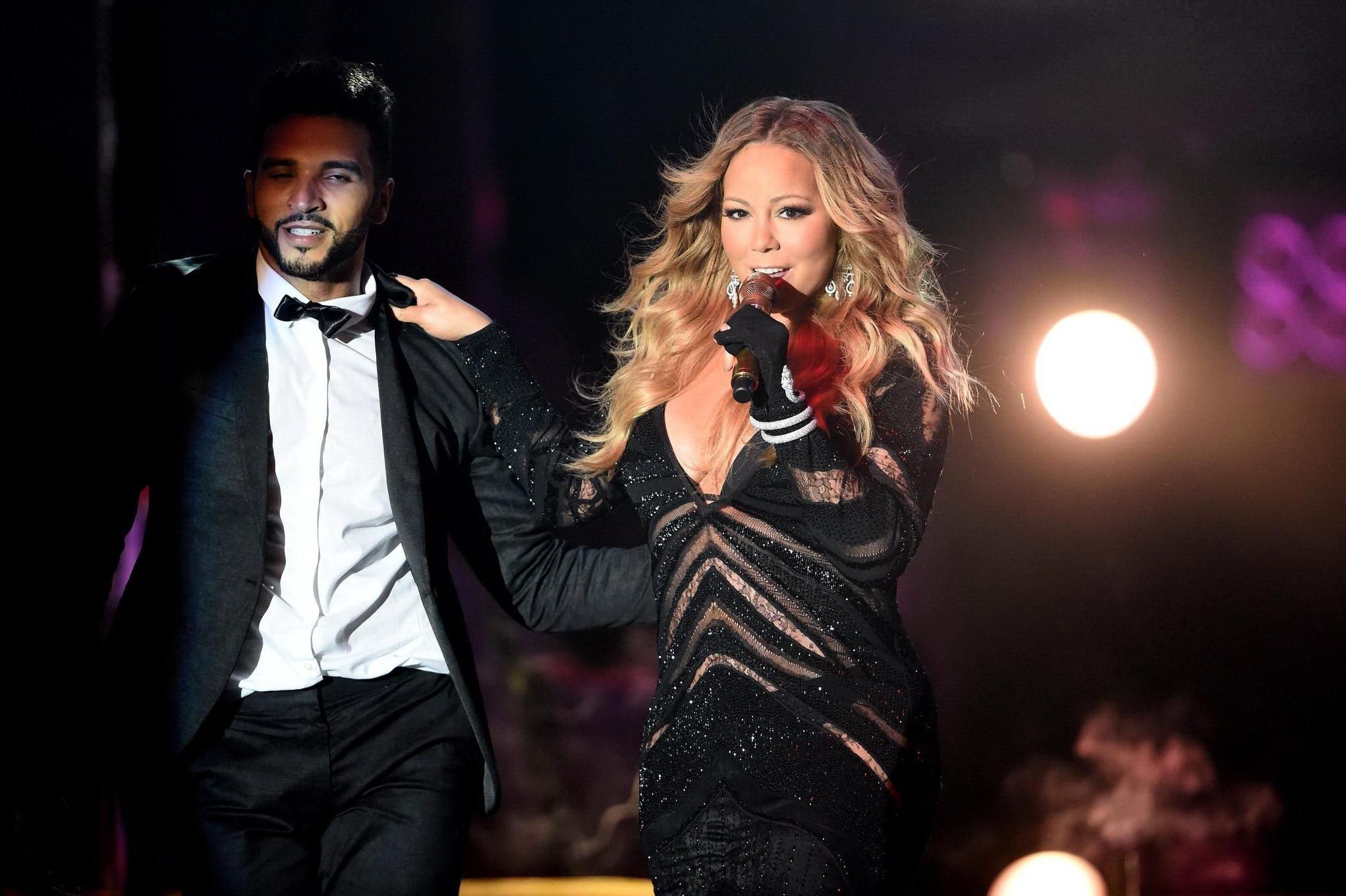 16P Mariah Carey cleavy wearing two skimpy dresses at the World Music Awards in Mont