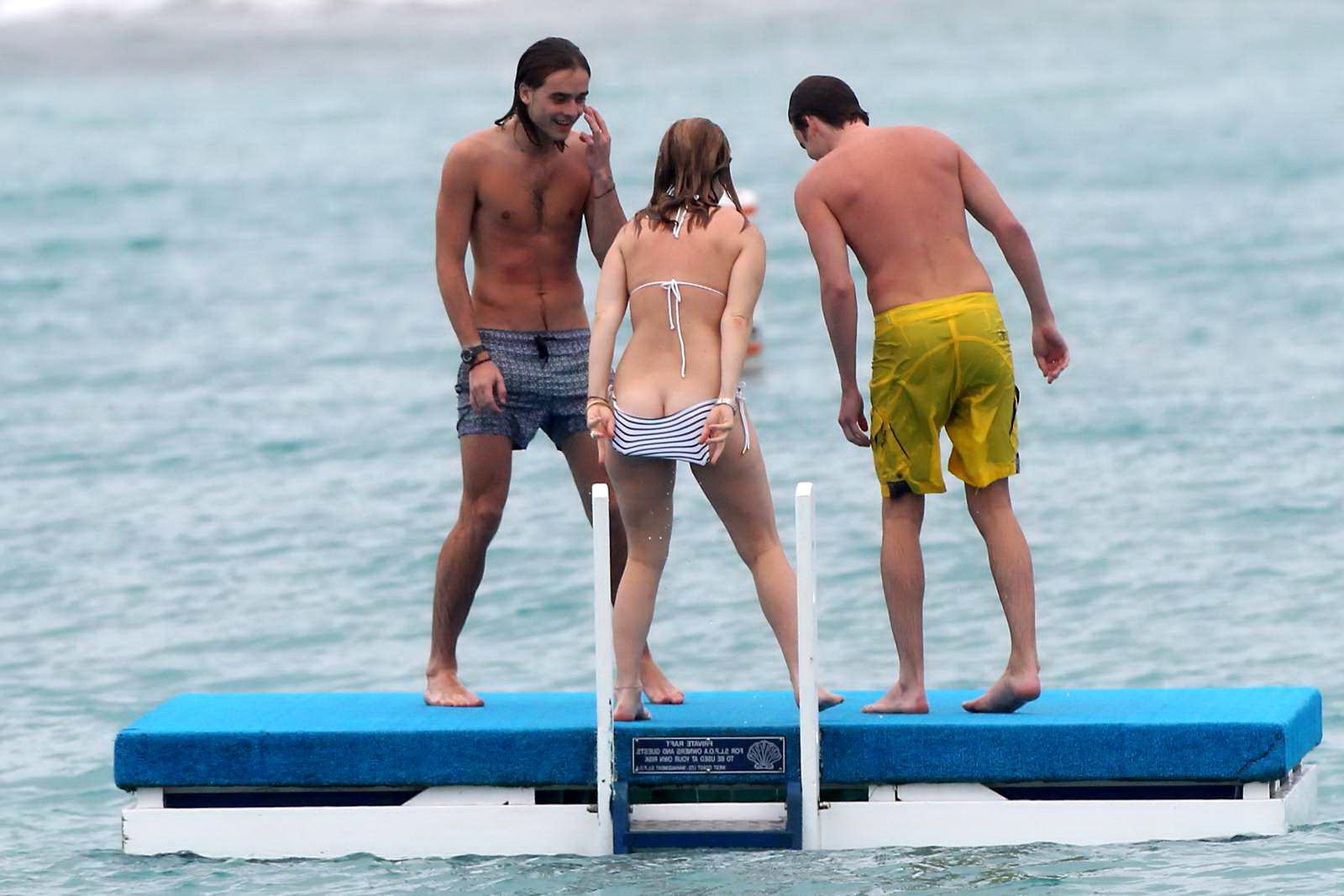 16P Alice Eve slipping out of her skimpy striped bikini on a beach in Barbados
