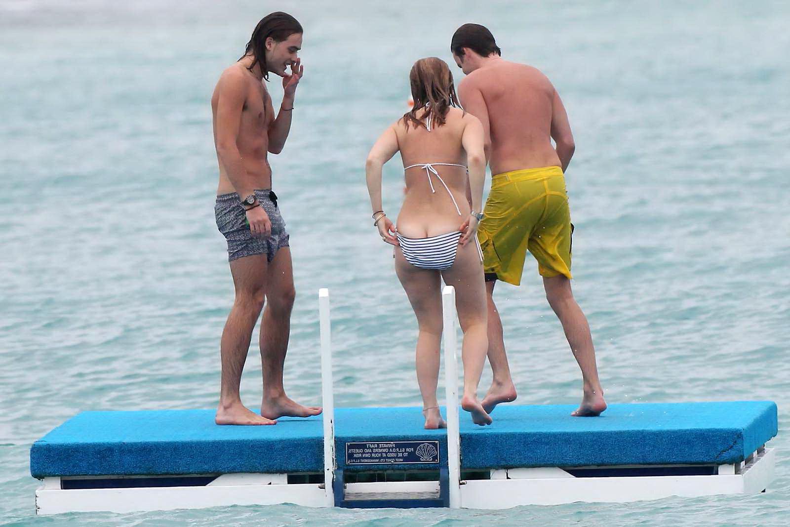 16P Alice Eve slipping out of her skimpy striped bikini on a beach in Barbados