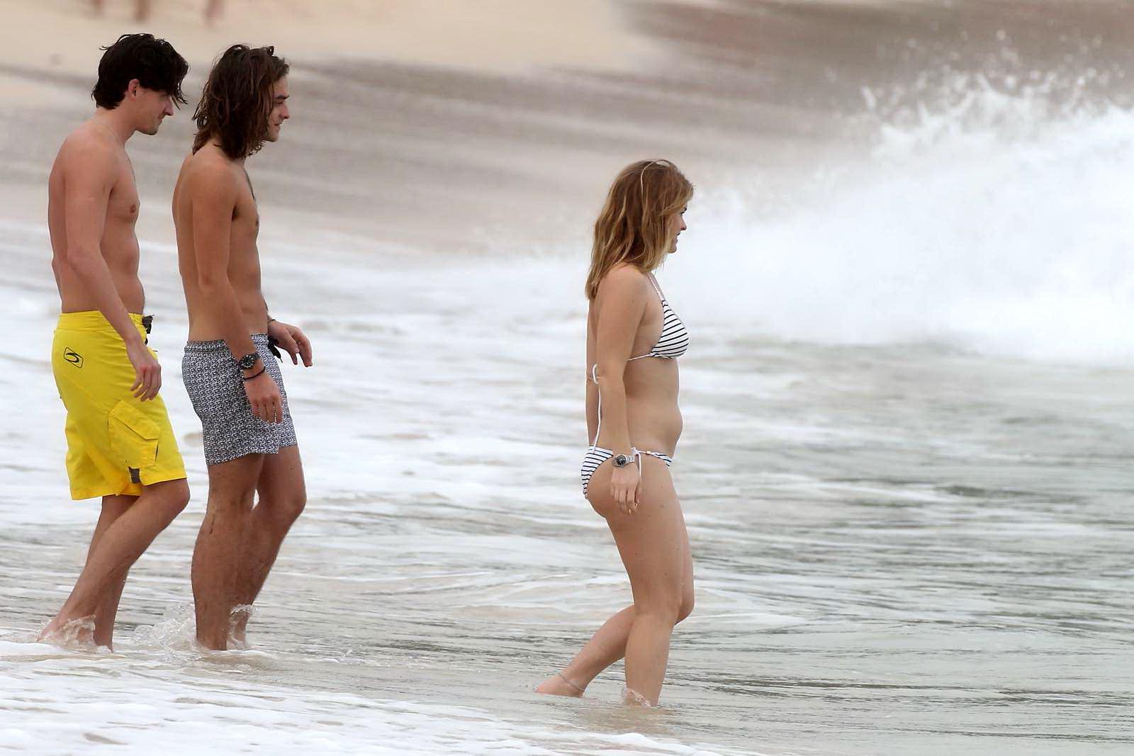 16P Alice Eve slipping out of her skimpy striped bikini on a beach in Barbados
