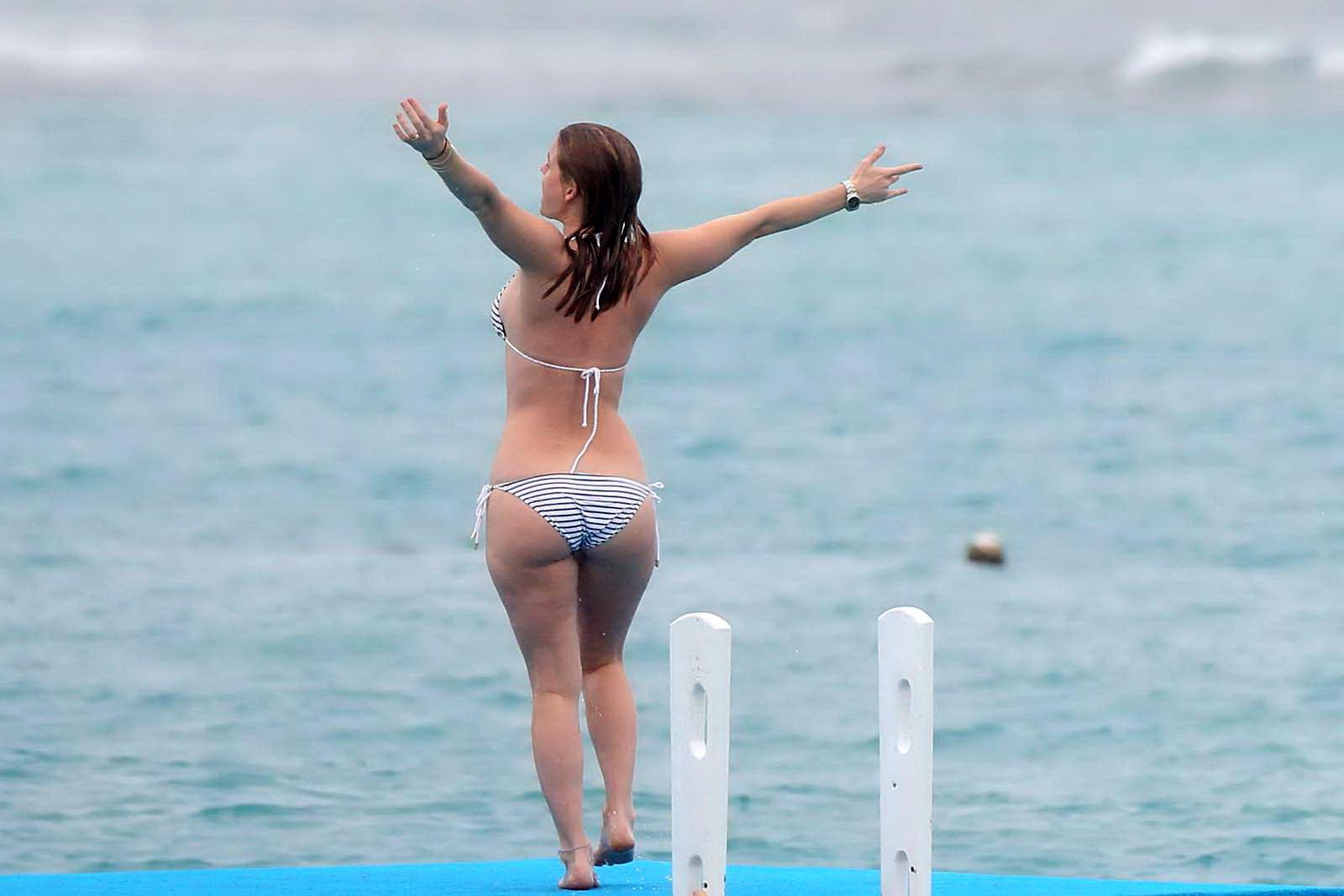 16P Alice Eve slipping out of her skimpy striped bikini on a beach in Barbados