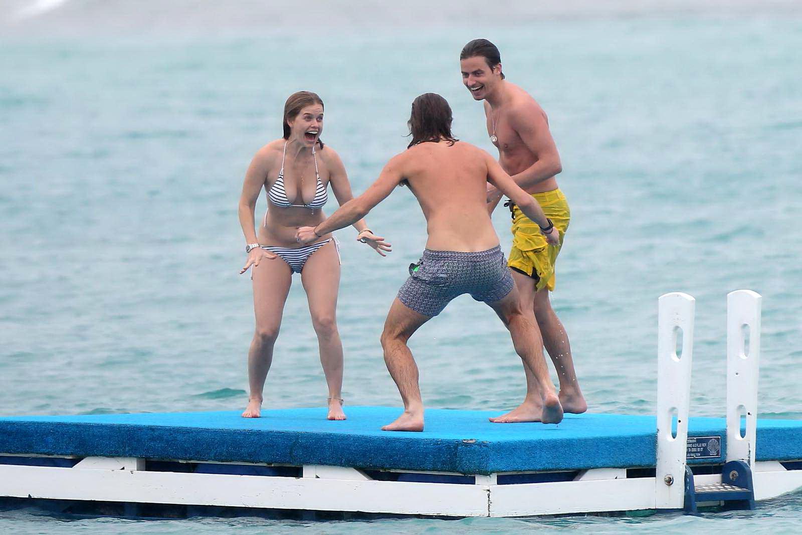 16P Alice Eve slipping out of her skimpy striped bikini on a beach in Barbados