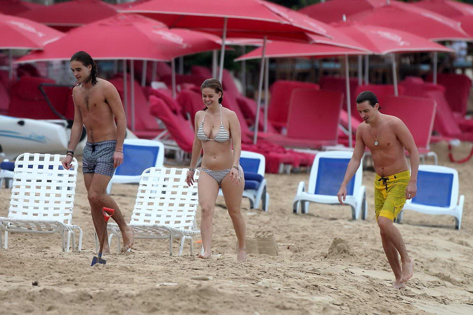 16P Alice Eve slipping out of her skimpy striped bikini on a beach in Barbados