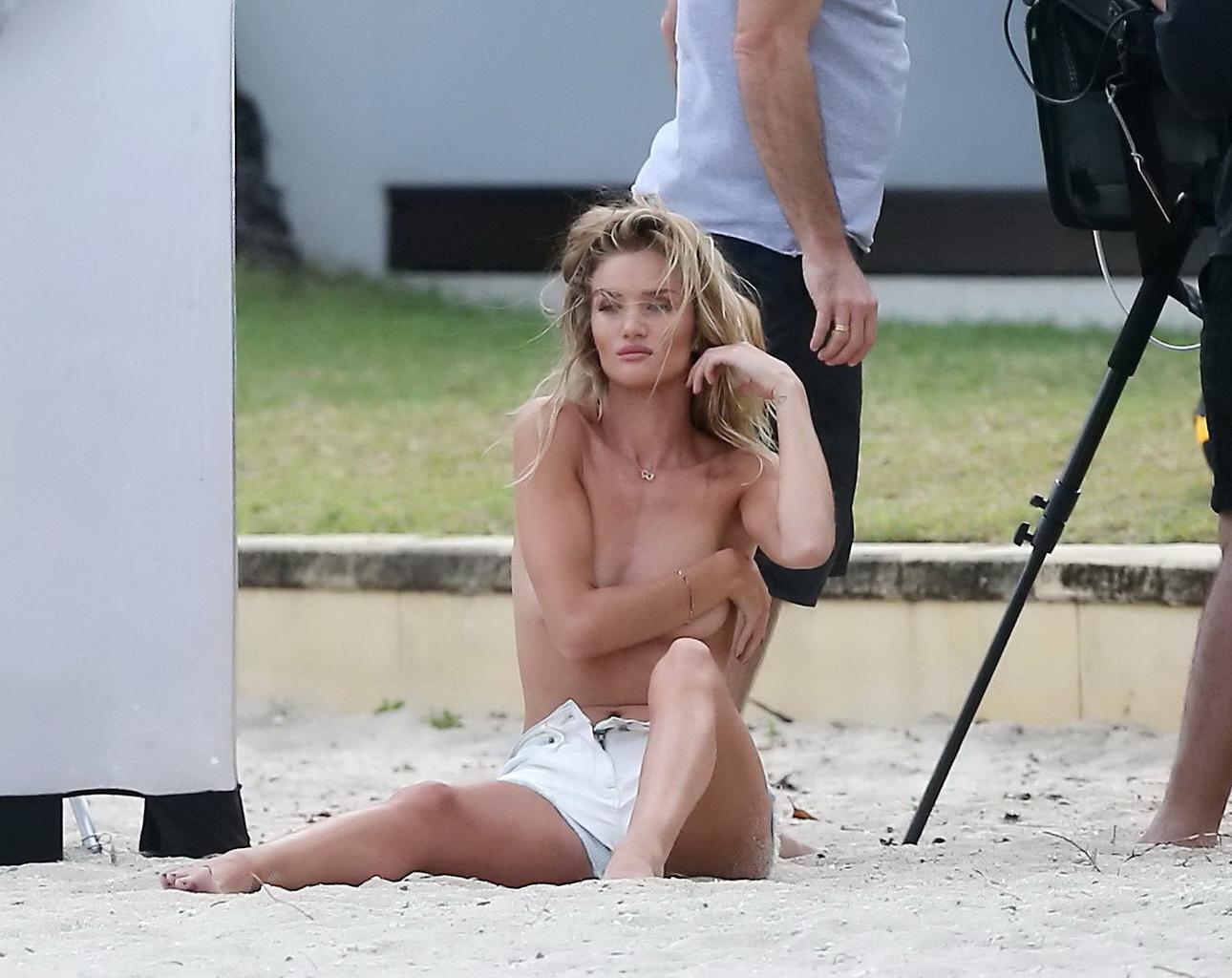 16P Rosie Huntington-Whiteley topless in a white denim shorts doing a beach photosho