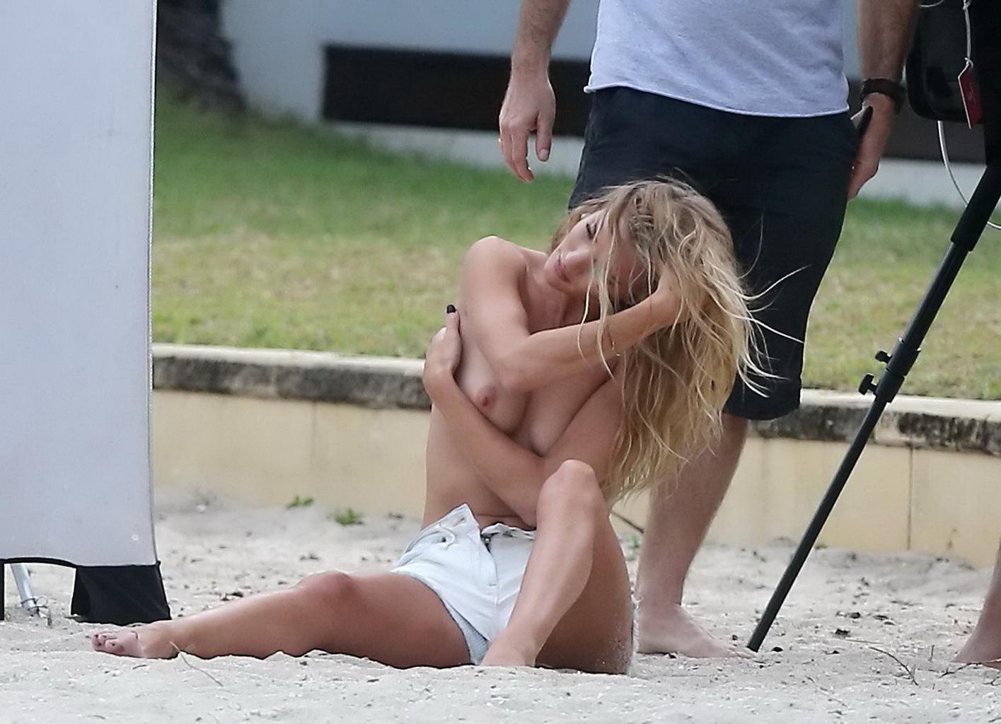 16P Rosie Huntington-Whiteley topless in a white denim shorts doing a beach photosho