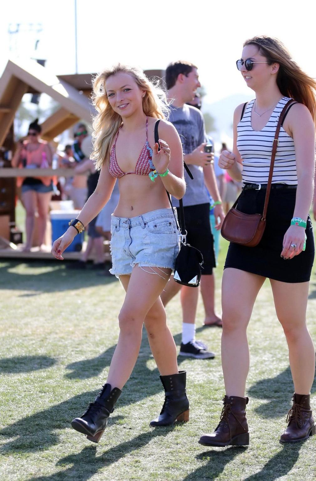 16P Francesca Eastwood wearing a bikini top  a denim shorts at Coachella Music  Arts
