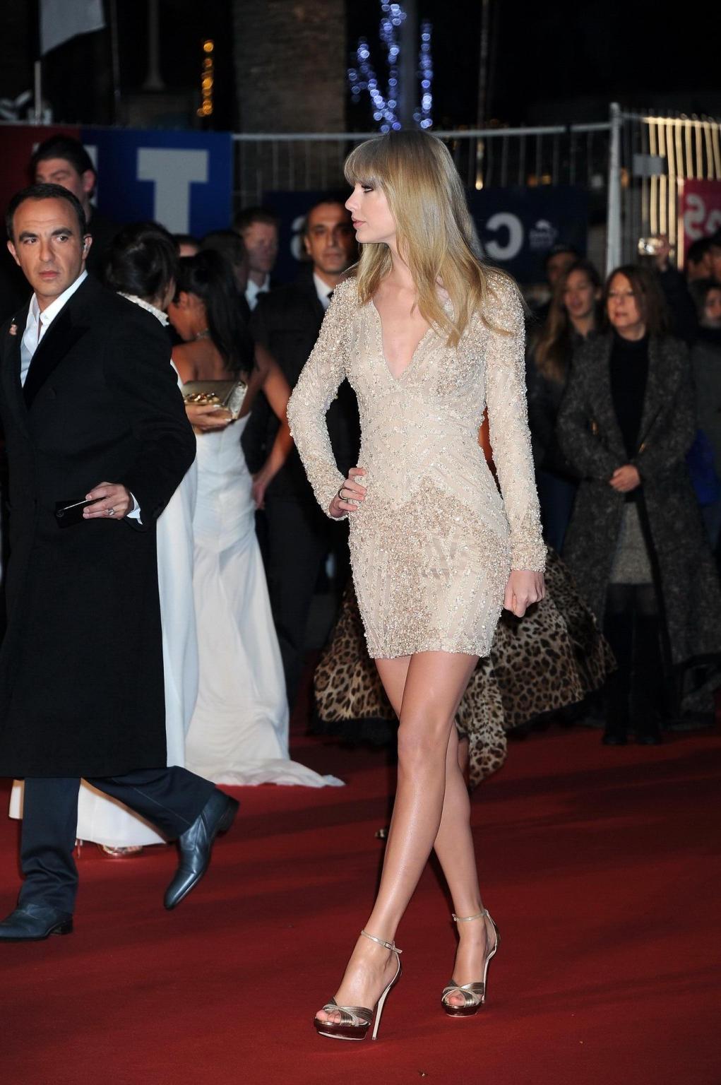 10P Taylor Swift leggy wearing a mini dress at 2013 NRJ Music Awards in Cannes