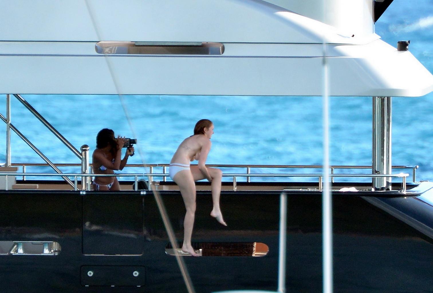 10P Busty Lily Cole diving topless from a yacht in St. Barts