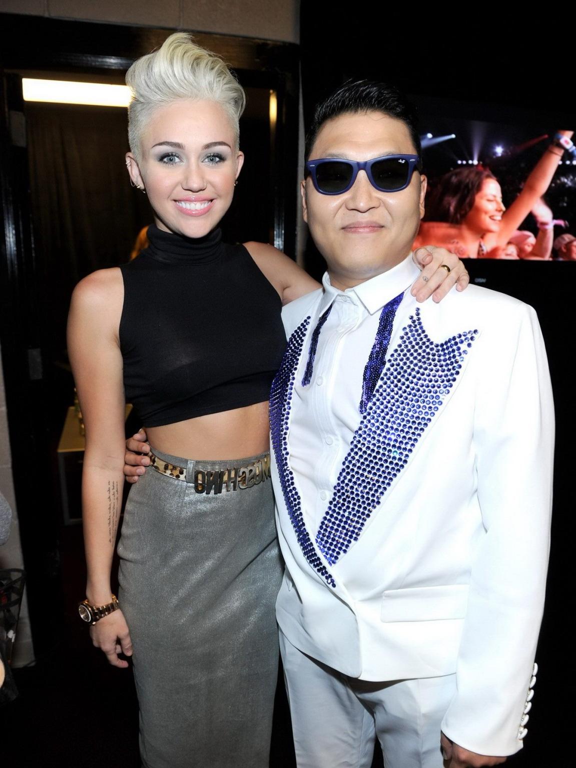 10P Miley Cyrus showing off her boobs in see through top at IHeartRadio music festiv