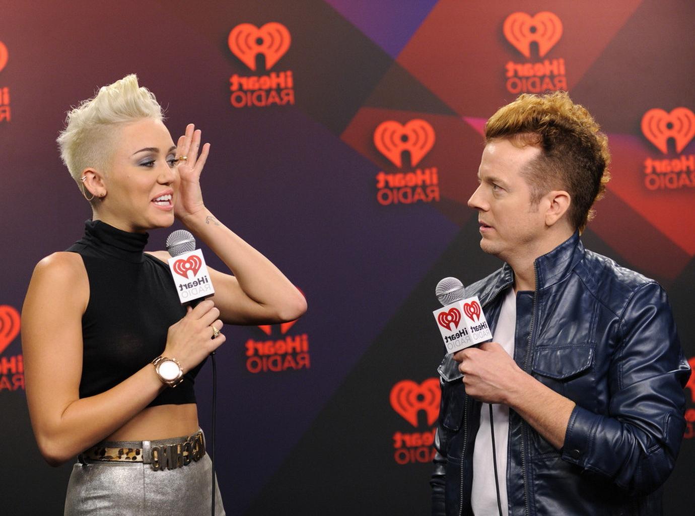 10P Miley Cyrus showing off her boobs in see through top at IHeartRadio music festiv