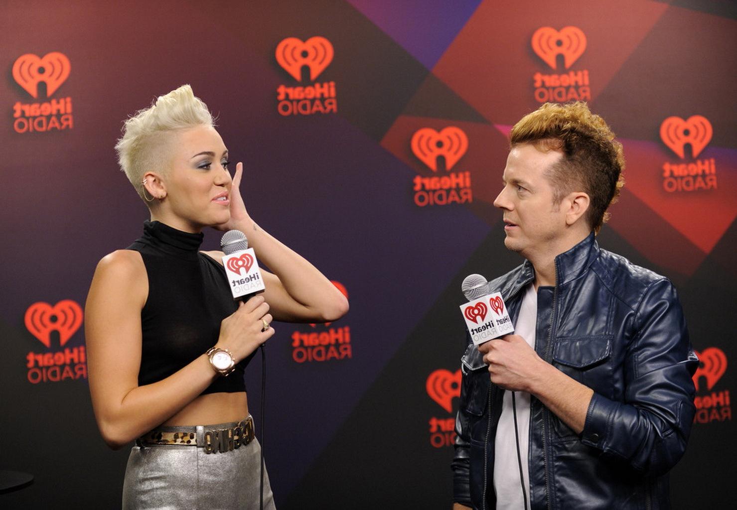 10P Miley Cyrus showing off her boobs in see through top at IHeartRadio music festiv