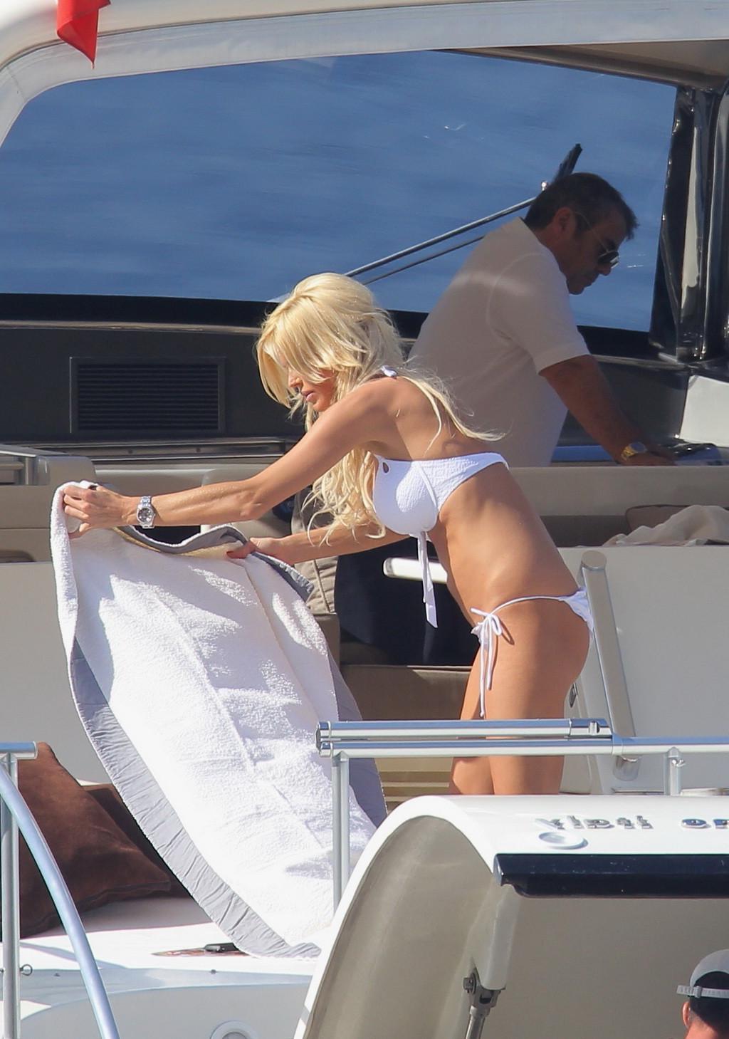 6P Victoria Silvstedt showing her big boobs and flashing juicy ass in skimpy white 