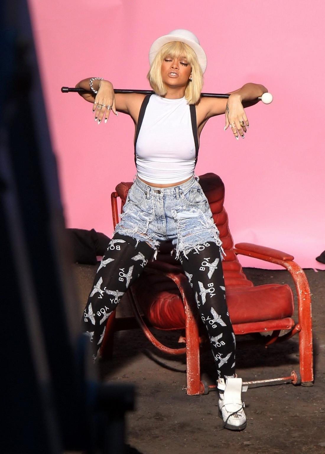 16P Rihanna braless shoots a music video in London wearing see through top