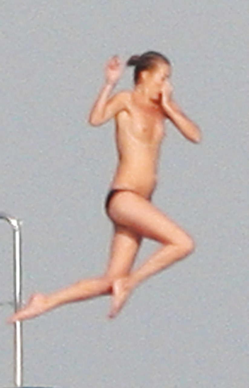 16P Kate Moss topless jumping from yach and showing her panties paparazzi shoots