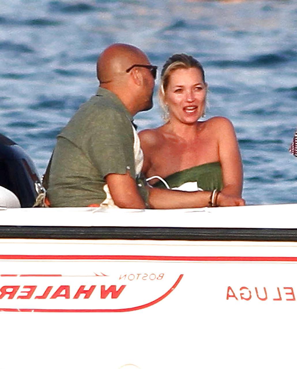 16P Kate Moss topless jumping from yach and showing her panties paparazzi shoots