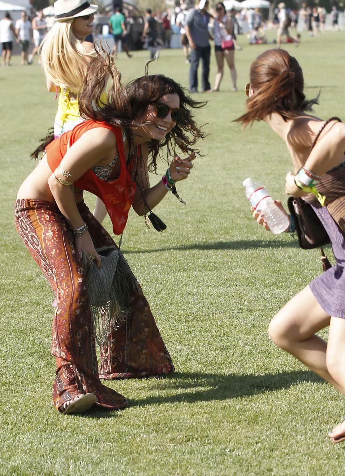 16P Vanessa Hudgens wearing bikini top at the Coachella Valley Music  Arts Festival