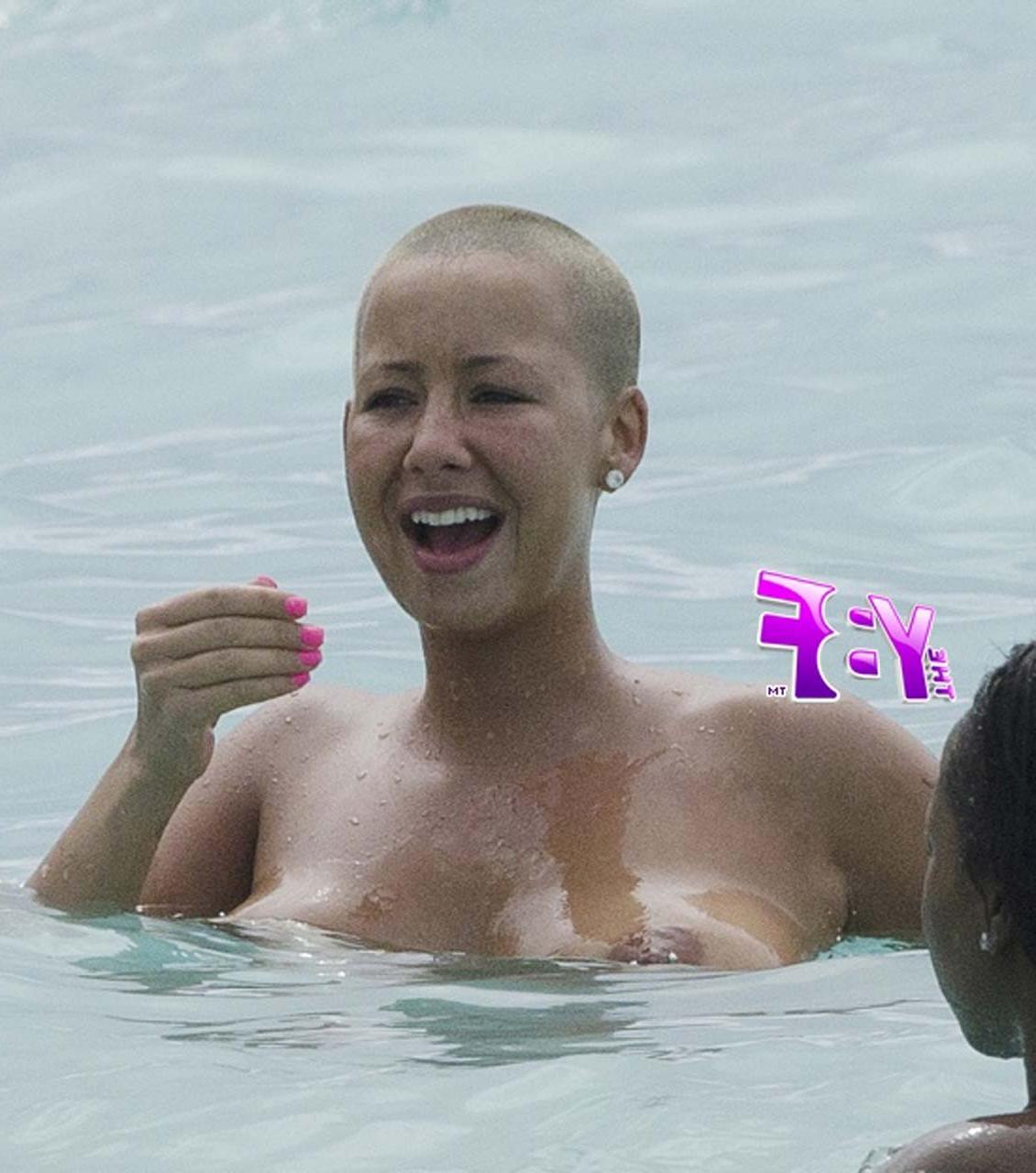 16P Amber Rose enjoying on beach in topless and exposing huge boobs