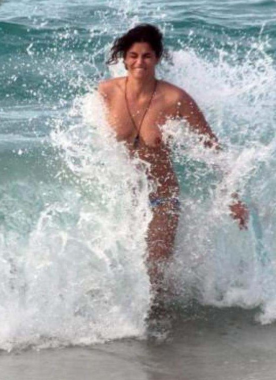 10P Shermine Shahrivar exposing her nice big tits topless on beach paparazzi picture