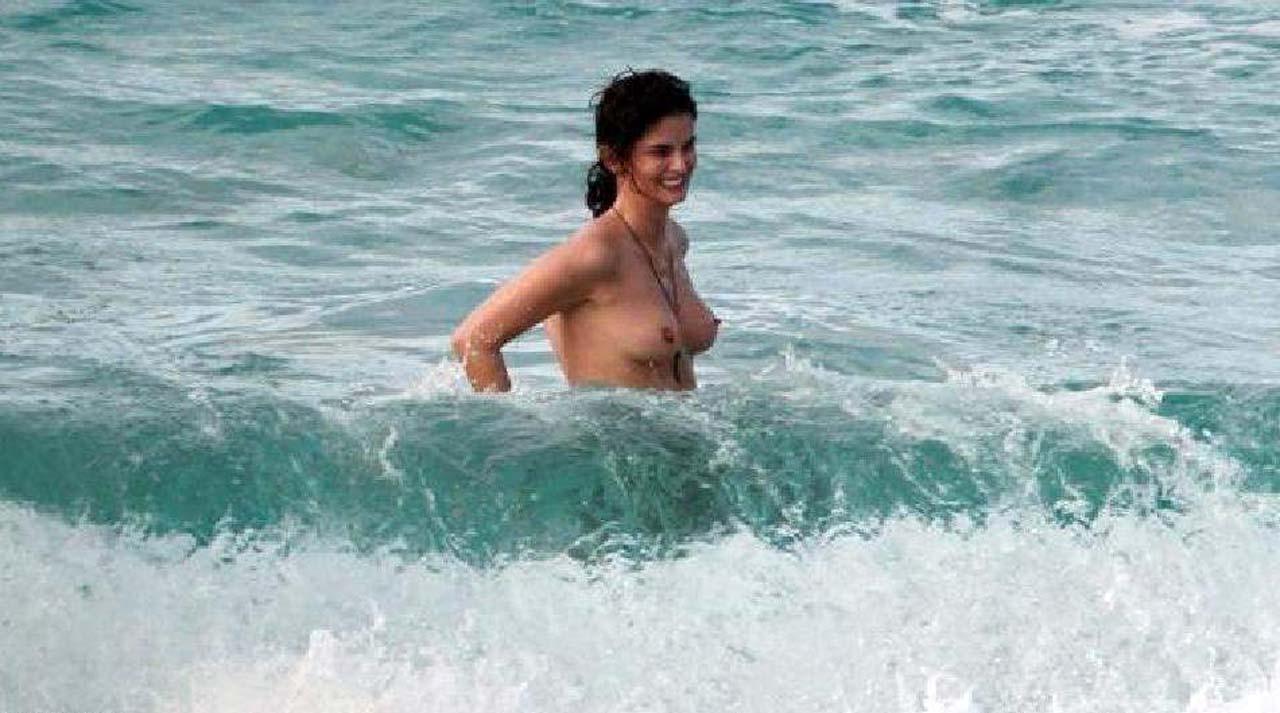 10P Shermine Shahrivar exposing her nice big tits topless on beach paparazzi picture