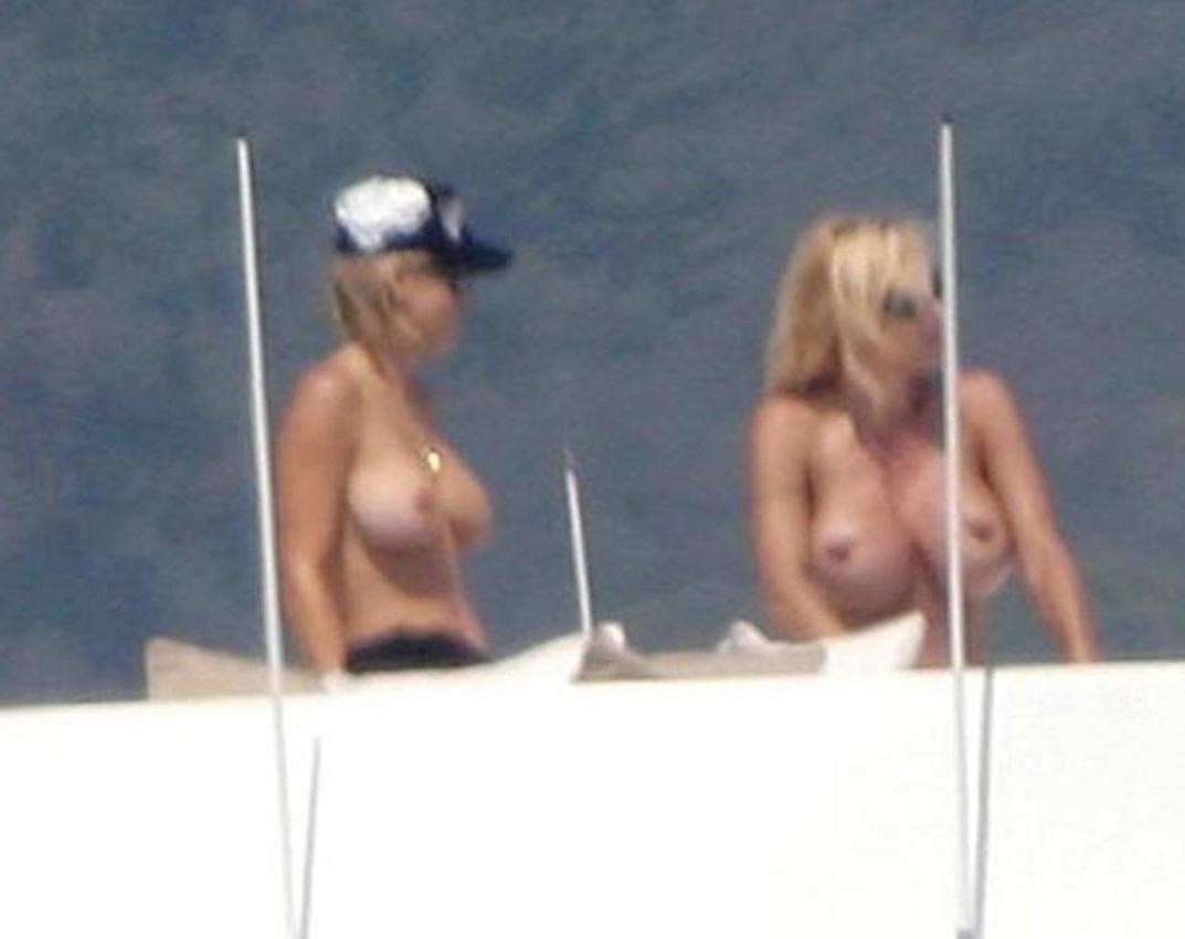 16P Pamela Anderson shows attractive topless on yacht