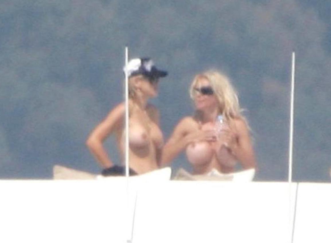 16P Pamela Anderson shows attractive topless on yacht
