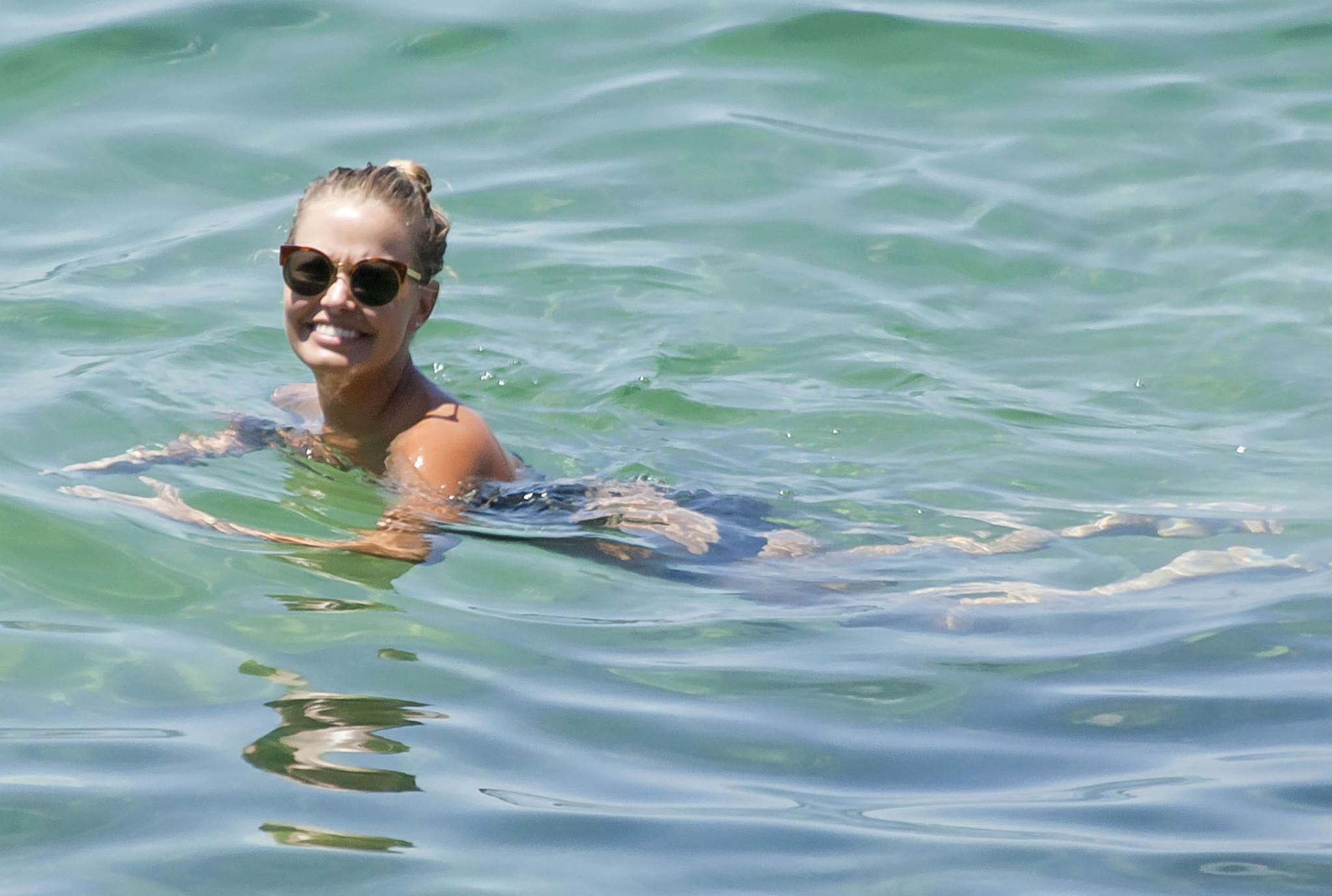 16P Busty Lara Bingle tanning topless on Bondi Beach in Sydney