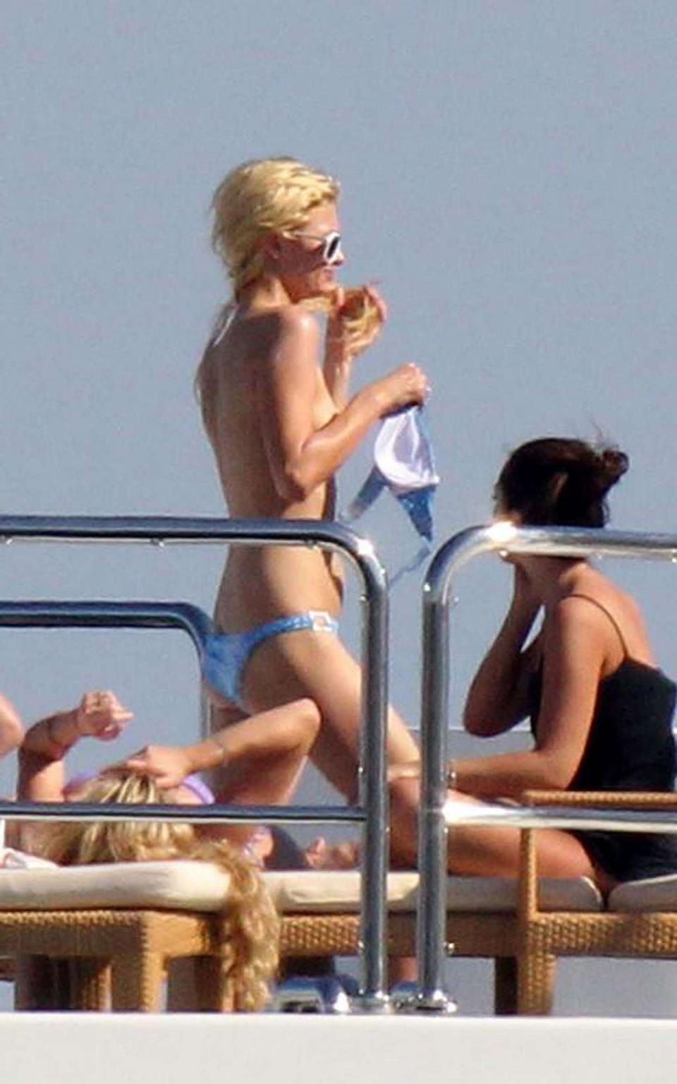 16P Paris Hilton exposing sexy body and enjoying in topless on yacht