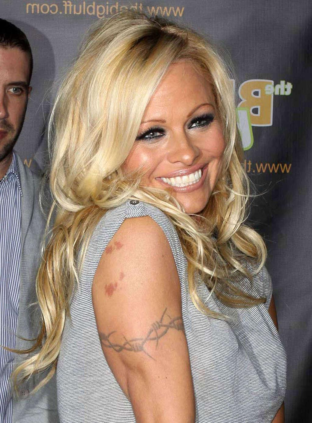 16P Pamela Anderson sexy in see thru dress and topless shoots