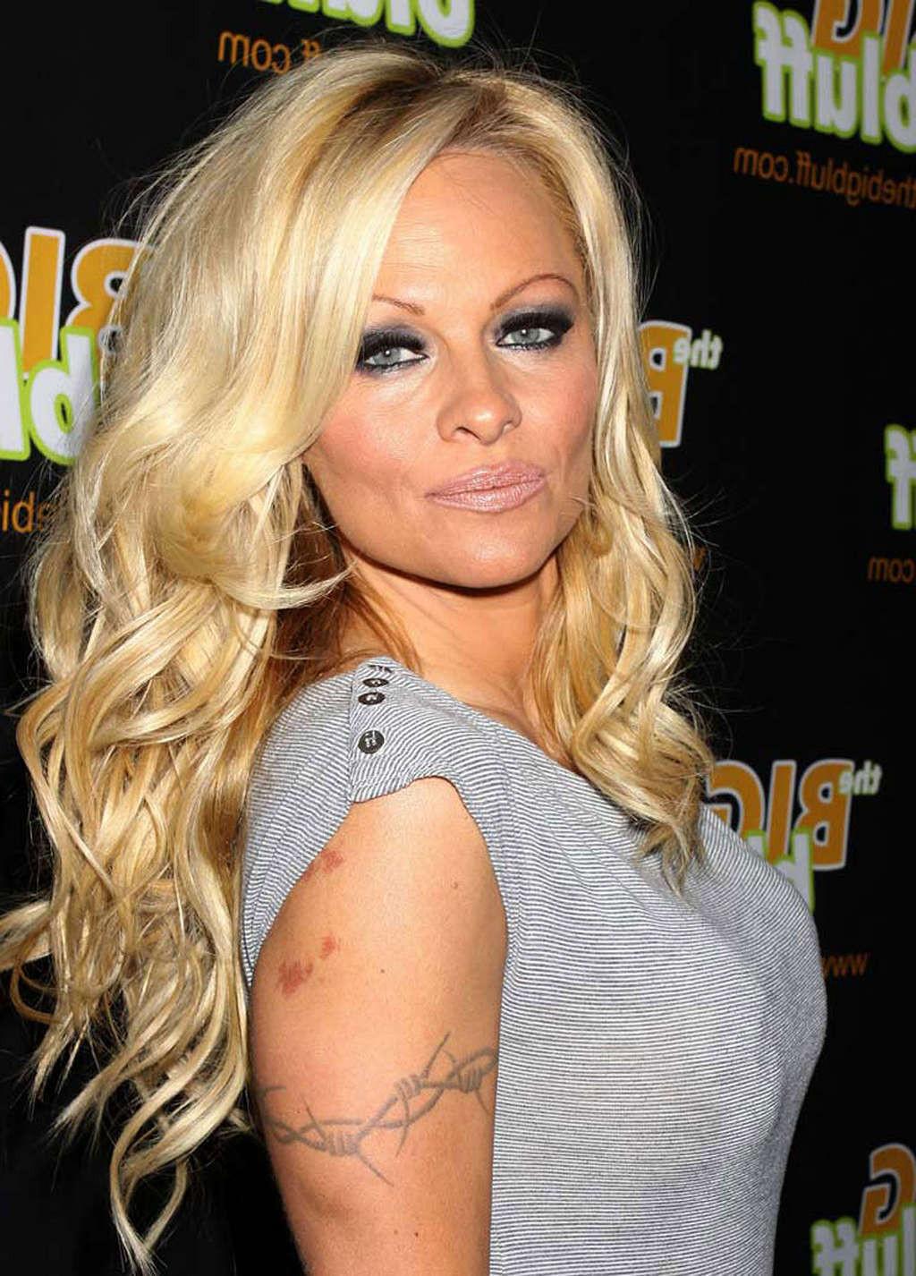 16P Pamela Anderson sexy in see thru dress and topless shoots