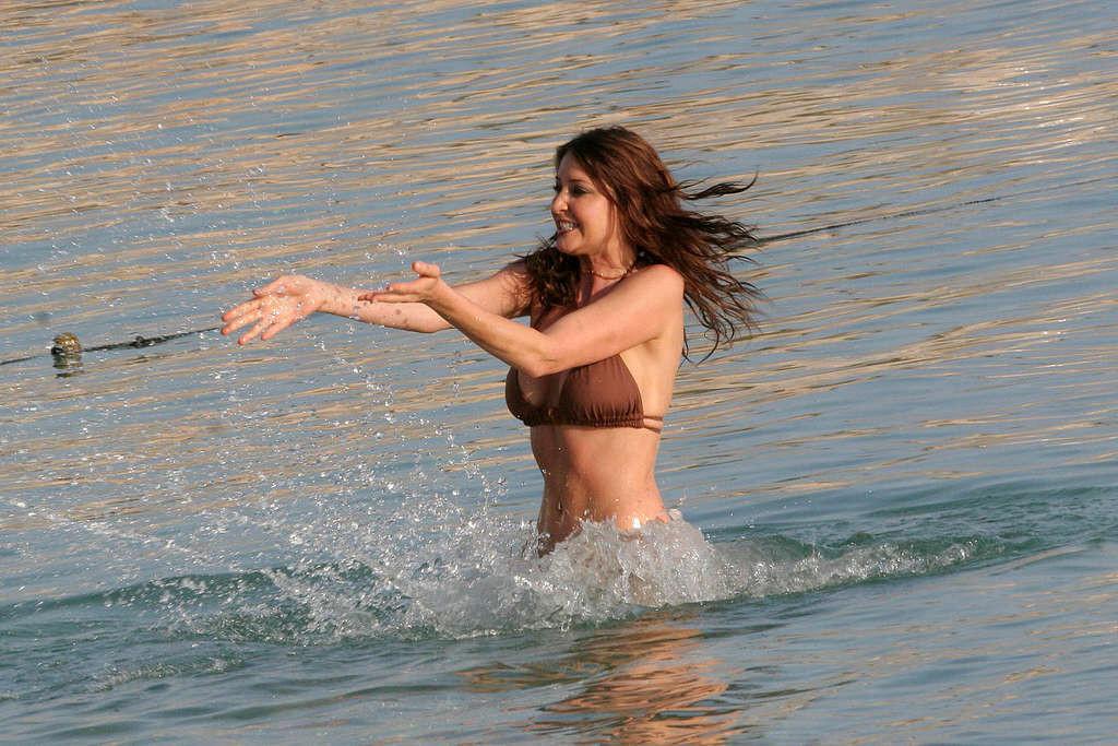 16P Lisa Snowdon posing topless and in bikini on beach