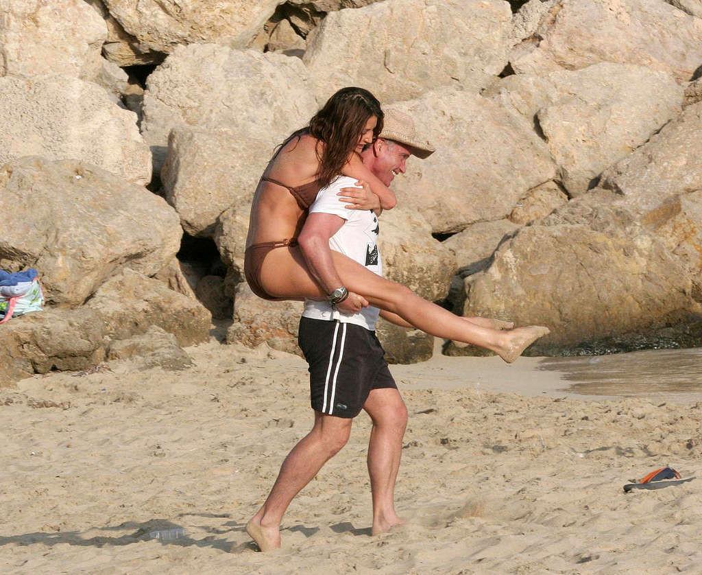 16P Lisa Snowdon posing topless and in bikini on beach