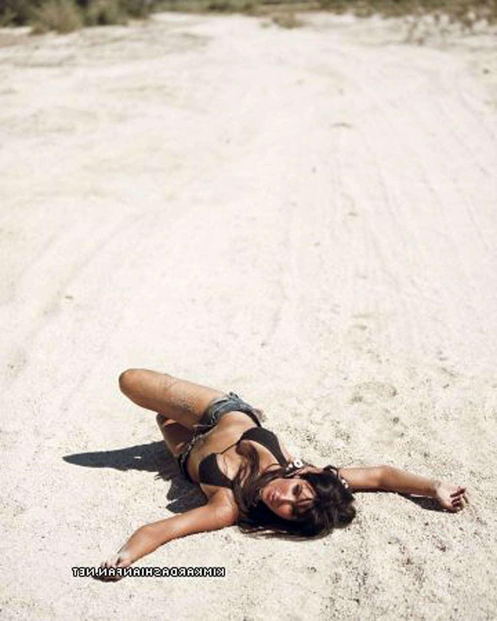 16P Kim Kardashian looking very sexy and topless posing on beach