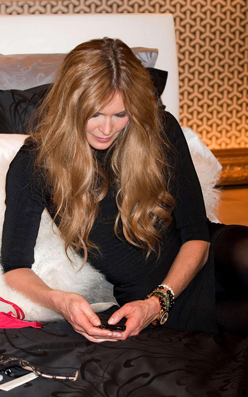 16P Elle Macpherson topless and leggy in black mini skirt