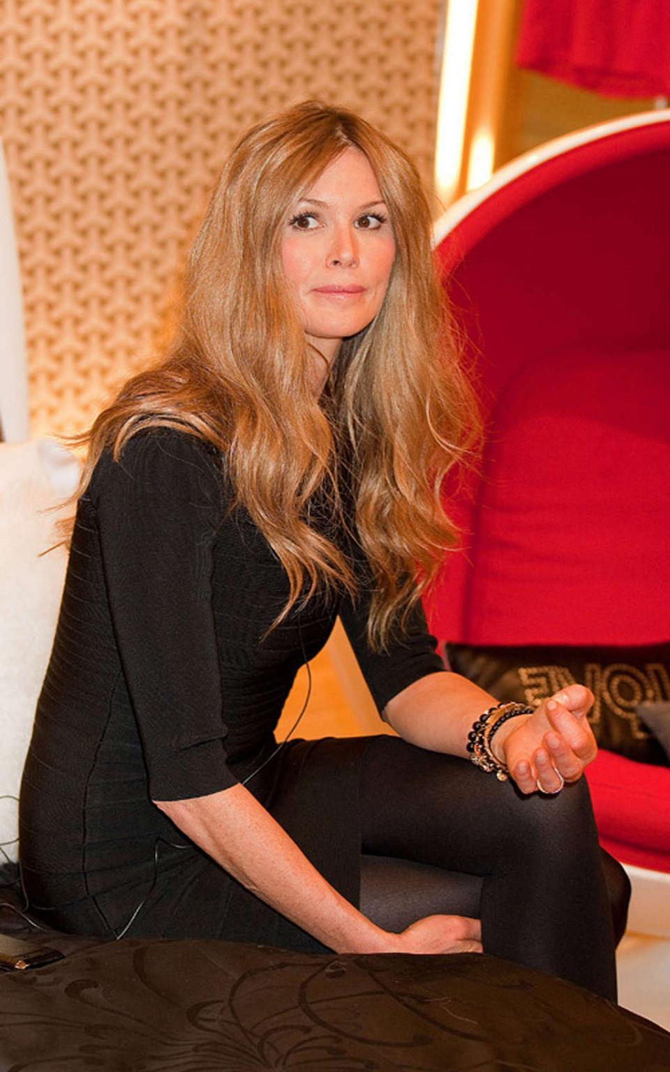 16P Elle Macpherson topless and leggy in black mini skirt